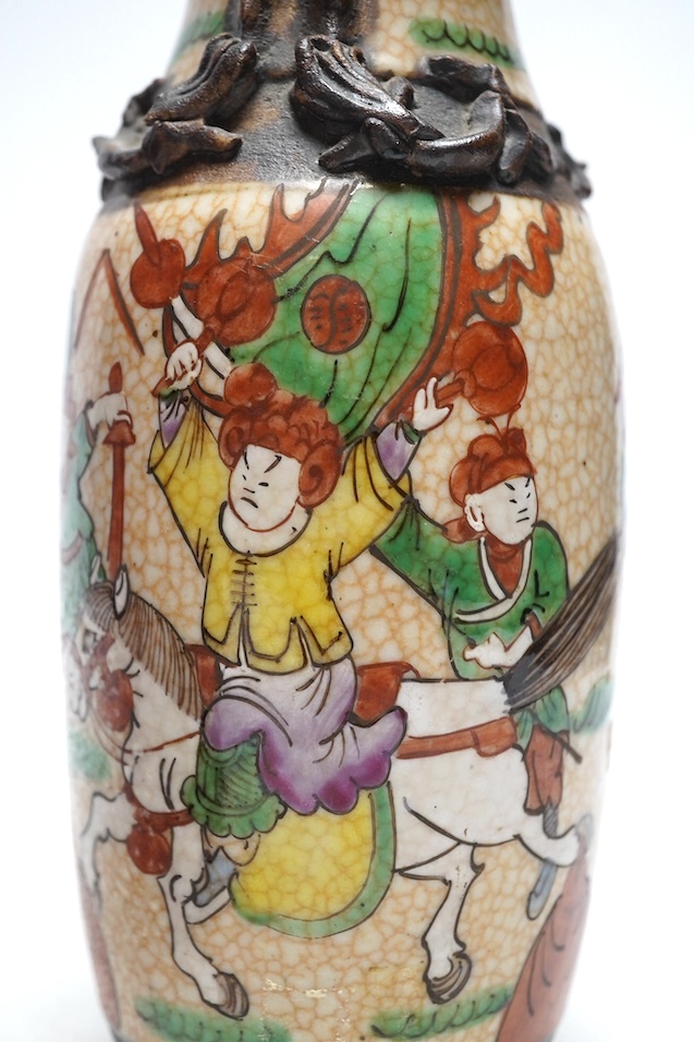 A 19th century Chinese crackle glazed vase and a ruby ground vase, tallest 25cm. Condition - crackle glazed vase with repair to rim, otherwise good